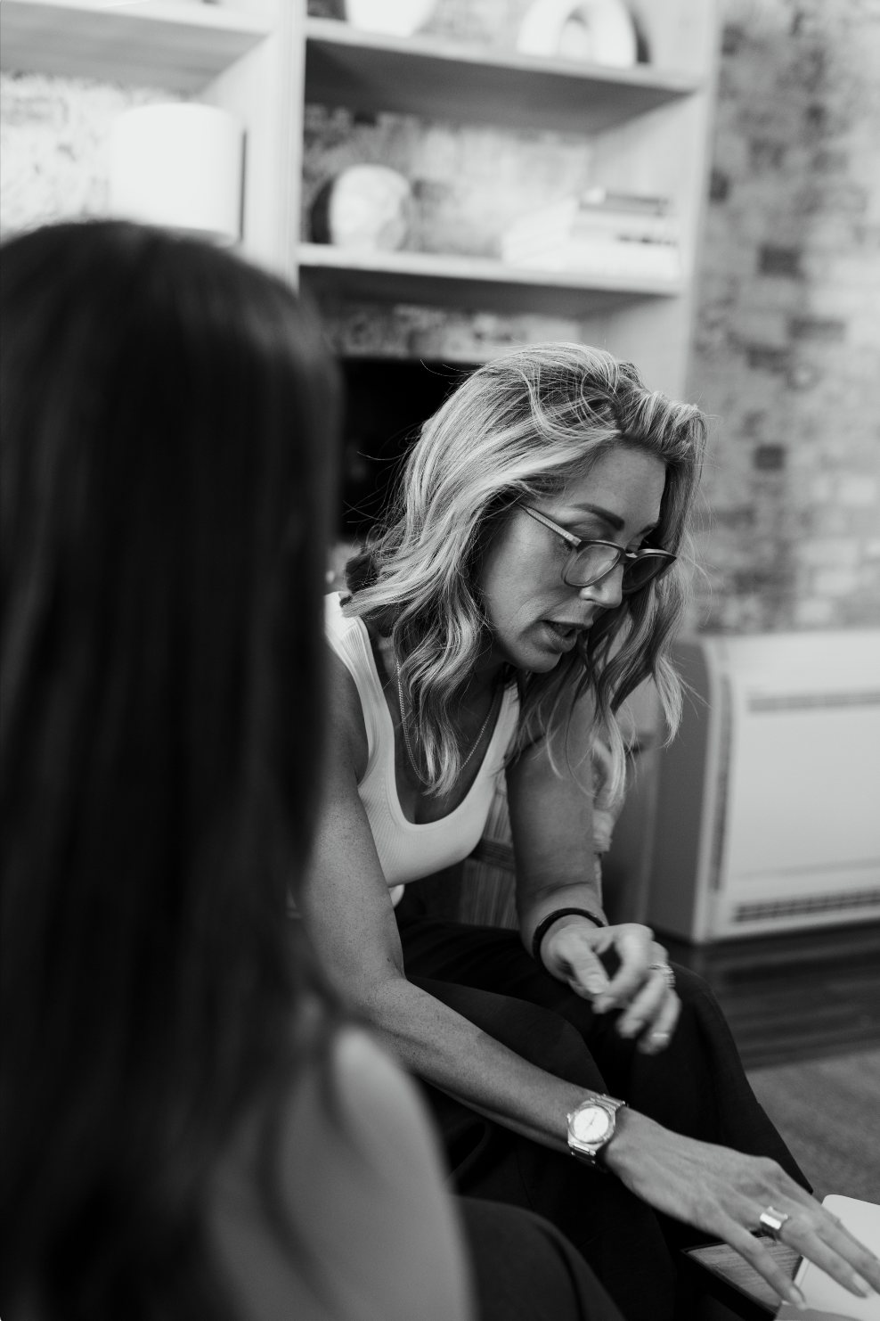 Jasmin Rankin leaning in to talk with a client